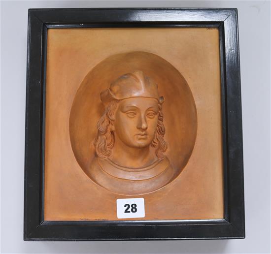 A terracotta portrait plaque in ebonised frame height 27cm width 25cm